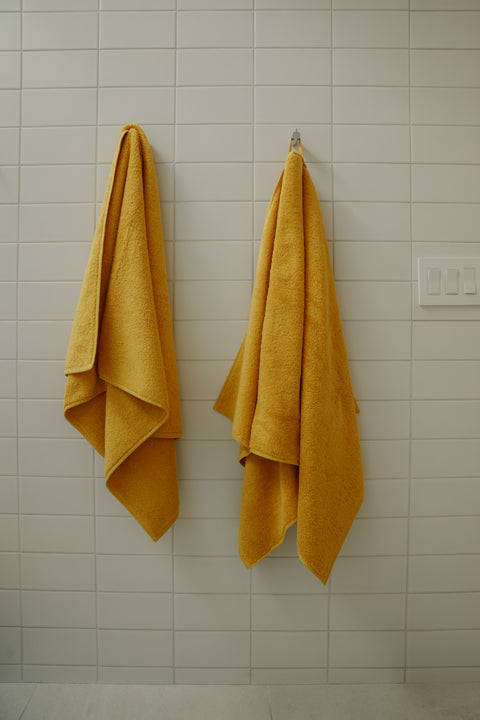 Organic bath towels in mustard yellow - by Takasa.co