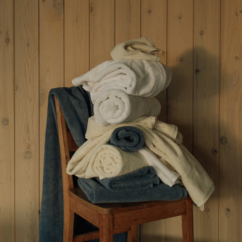 Takasa organic bath towels on a chair