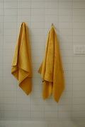 Organic bath towels in mustard yellow - by Takasa.co