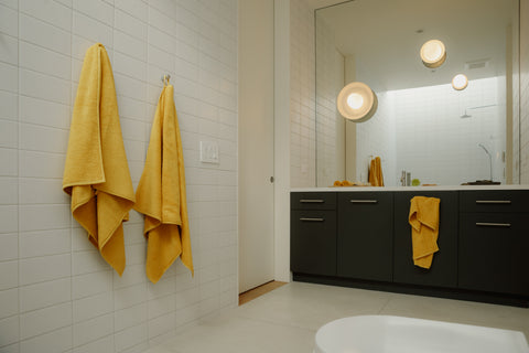 Organic bath towels in yellow by Takasa